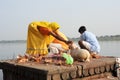 People performs pooja on sacred river Narmada in Maheshwar