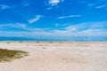 People with pets relaxing on Seacliff beach in Holdfast Bay in S