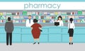 People in the pharmacy. Pharmacists stands near the shelves with medicines