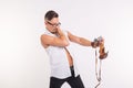 People, photo and style concept - happy young man taking selfie with old photo camera on white background Royalty Free Stock Photo