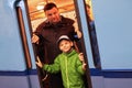 People photographed in the doorway of an old subway car