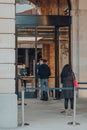 People picking up orders outside Apple Store in Covent Garden, London, UK, staff and customer wearing face shields PPE