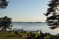 People picnic by the lake side public bath at the evening