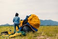 People Pitch a tent on the ground near the lake. Relaxing, traveling, long weeked, holiday concept Royalty Free Stock Photo