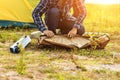 People Pitch a tent on the ground near the lake. Relaxing, traveling, long weeked, holiday concept Royalty Free Stock Photo