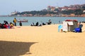 People play on the beach in Qingdao, China