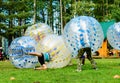 People play bumperball outdoor, Zorbsoccer Royalty Free Stock Photo