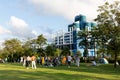 15 5 2021 people play on grass field with city landscape of building in Tsim Sha Tsui, Kowloon Peninsula in background, seen in