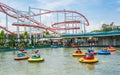 People play lifebuoy-shape boat in the amusment park