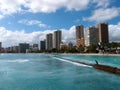 People play in the protected water and hang out on the beach in Royalty Free Stock Photo