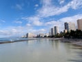 People play in the protected water and hang out on the Kuhio Beach Royalty Free Stock Photo