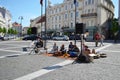 People play sing indian songs sit on street carpet
