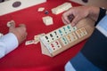 People play popular logic table game rummikub