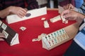 People play popular logic table game rummikub Royalty Free Stock Photo