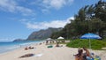 People play in water and sunbath as Gentle wave lap