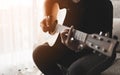 People playing acoustic guitar in the living room Royalty Free Stock Photo