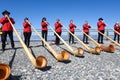 People playing the alphorn at Mount Generoso on Switzerland