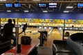 People playing bowling in a bowling saloon