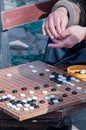 People playing chinese chess (go), on a bench Royalty Free Stock Photo