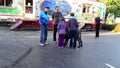 People playing with dog at the West Coast Amusements Carnival