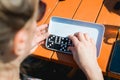 People playing domino game for leisure. orange table Royalty Free Stock Photo