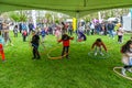 People playing with hula hoop in festival, London