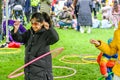 People playing with hula hoop in festival, London