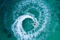 People are playing a jet ski in the sea.Aerial view. Top view.amazing nature background. The color of the water and beautifully Royalty Free Stock Photo