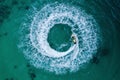 People are playing a jet ski in the sea.Aerial view. Top view.amazing nature background. The color of the water and beautifully Royalty Free Stock Photo