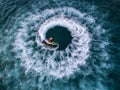 People are playing a jet ski in the sea.Aerial view. Top view.amazing nature background.The color of the water and beautifully br Royalty Free Stock Photo