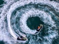 People are playing a jet ski in the sea.Aerial view. Top view.amazing nature background.The color of the water and beautifully br Royalty Free Stock Photo