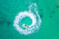 People are playing a jet ski in the sea.Aerial view. Top view.amazing nature background.The color of the water and beautifully Royalty Free Stock Photo