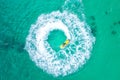People are playing a jet ski in the sea.Aerial view. Top view.amazing nature background.The color of the water and beautifully Royalty Free Stock Photo