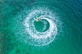 People are playing a jet ski in the sea.Aerial view. Top view.amazing nature background.The color of the water and beautifully Royalty Free Stock Photo