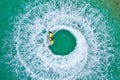 People are playing a jet ski in the sea.Aerial view. Top view.amazing nature background.The color of the water and beautifully Royalty Free Stock Photo