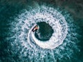 People are playing a jet ski in the sea.Aerial view. Top view.amazing nature background.The color of the water and beautifully br Royalty Free Stock Photo