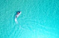 People are playing a jet ski in the sea.Aerial view. Top view.amazing nature background.The color of the water and beautifully br Royalty Free Stock Photo