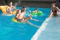 People playing in the swimming pool Royalty Free Stock Photo