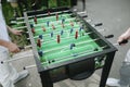 People playing table football close-up outdoors Royalty Free Stock Photo