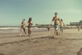 People playing tejos in the beach