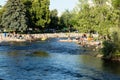 People playing in the Truckee River in downtown Reno in the summer Royalty Free Stock Photo