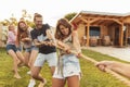 People playing tug of war while on team building trip Royalty Free Stock Photo