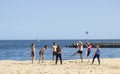 People playing volleyball on the beach