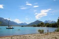 People playing in the water at lake Wakatipu, Glenorchy, south island, New Zealand