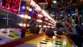 People playing whack game at West Coast Amusements Carnival