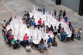 People playing with white Lego bricks in the Turbine Hall at Tate Modern, London UK. Royalty Free Stock Photo