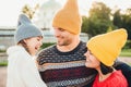 People, pleasant emotions and happiness concept. Happy young parents and their little adorble girl stand together, enjoy togethern Royalty Free Stock Photo