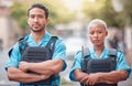 People, police and arms crossed in city for law enforcement, safety and protection outdoors. Portrait of man and woman