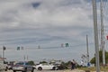 People and Police officer at a wreck white Camero