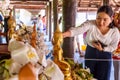 People pour water over Buddha statues Royalty Free Stock Photo